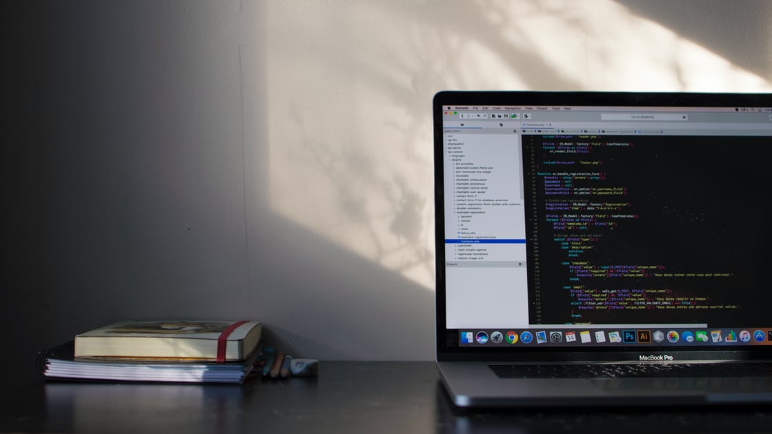 Laptop with code and books
