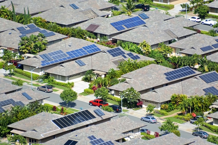 Aerial shot of homes with solar panels on roof