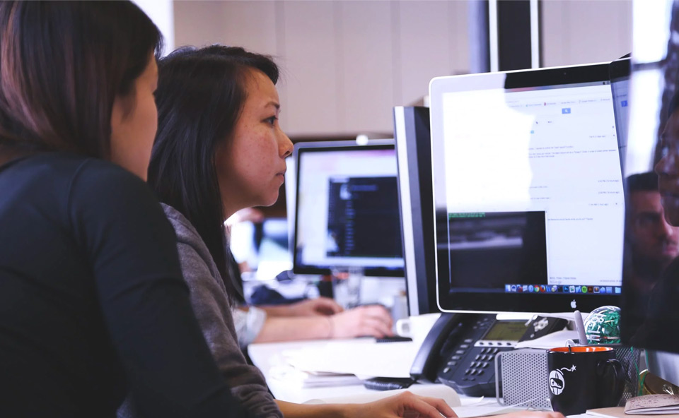 Two people at a computer